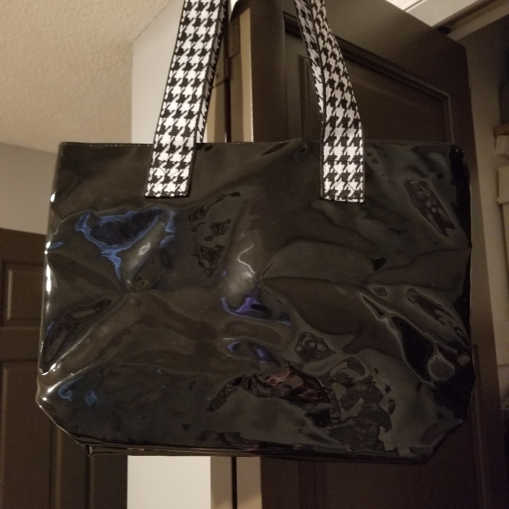 Patent black bag with plaid strap